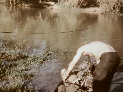 Trying to keep our gear dry during a stream crossing